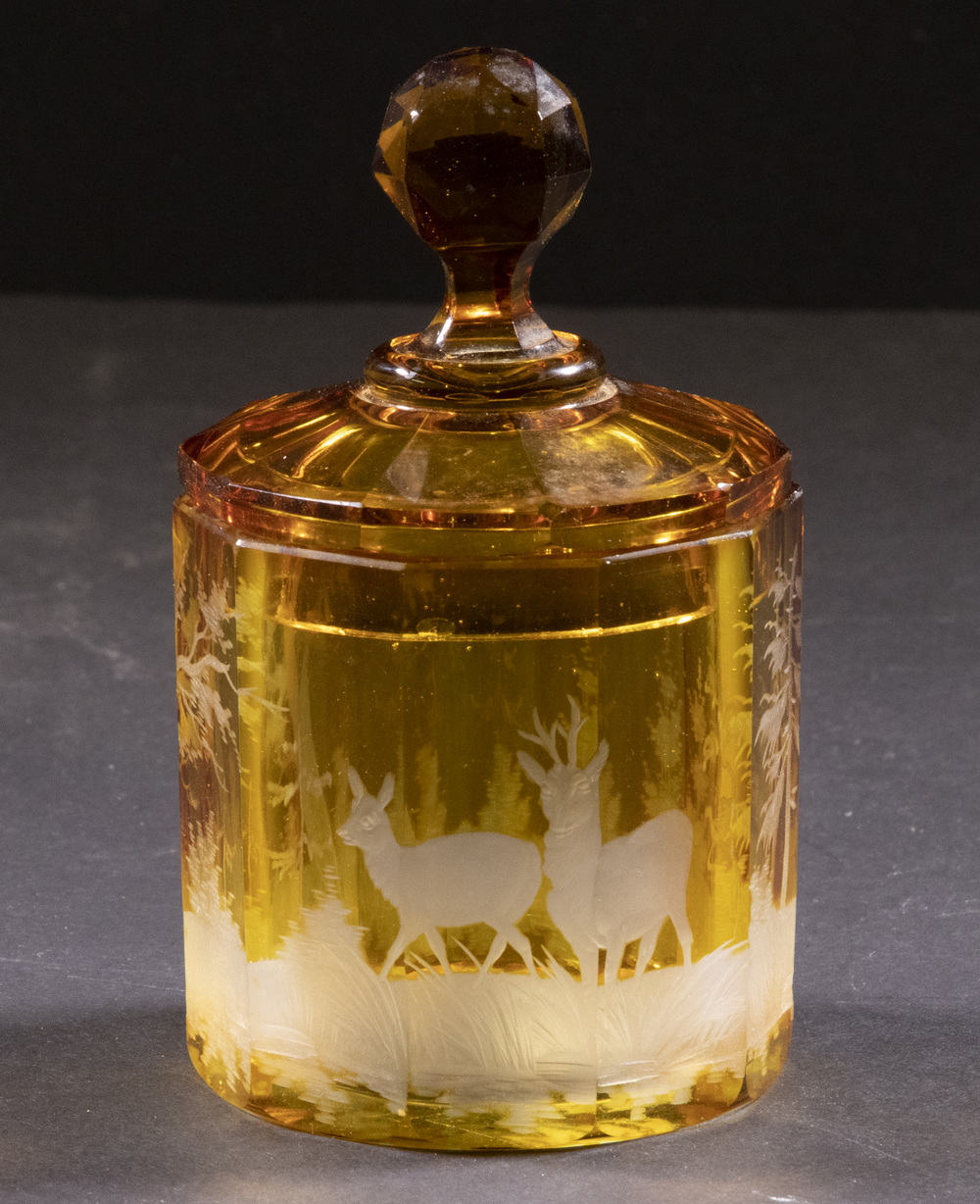 Appraisal: BOHEMIAN AMBER GLASS LIDDED JAR Cut to Clear Glass Vanity