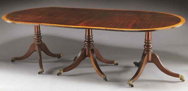 Appraisal: Georgian style three pedestal dining table the top with rounded