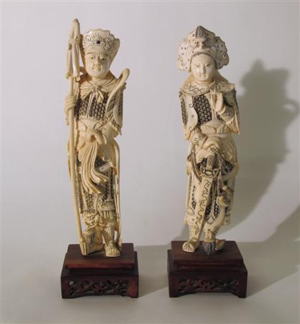 Appraisal: Pair of Chinese carved elephant ivory warrior figures late qing