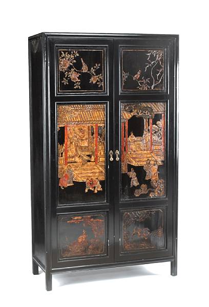 Appraisal: A Chinese style ebonized cabinetincorporating th century Chinese coromandel panels