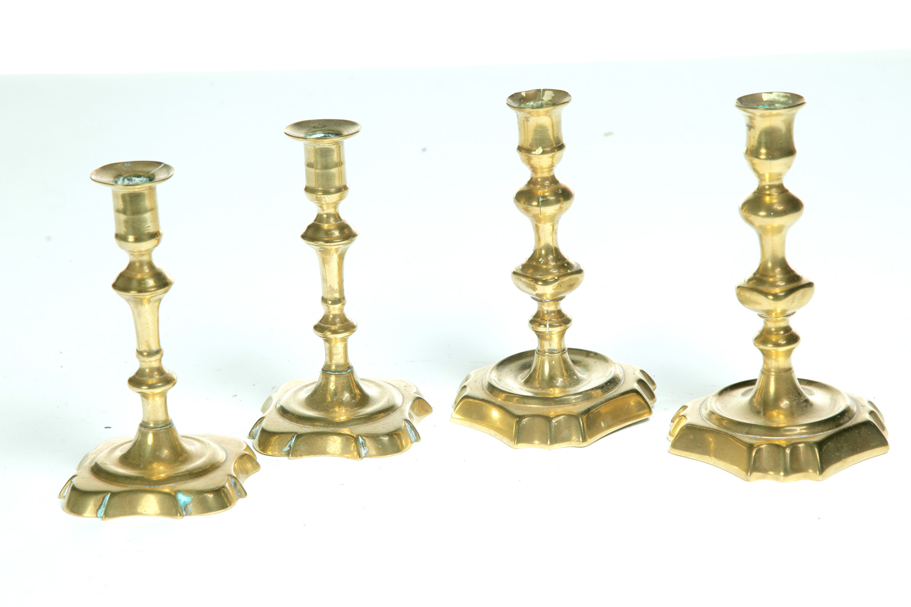 Appraisal: TWO PAIR OF BRASS CANDLESTICKS Probably England mid th century