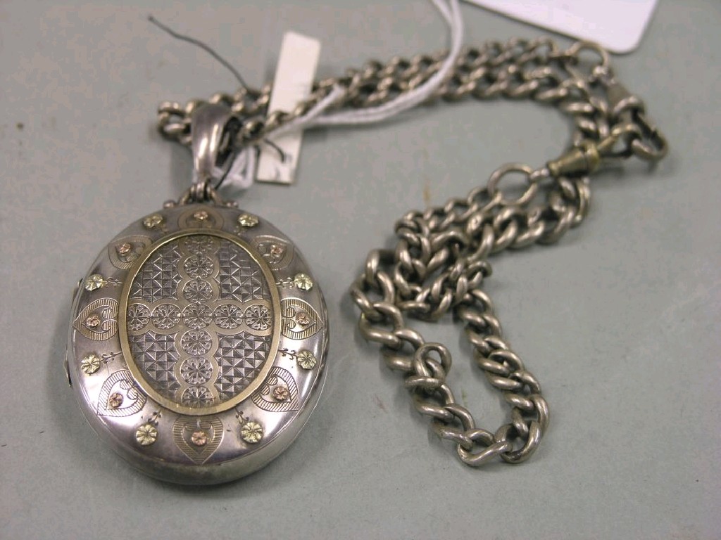 Appraisal: A Victorian engraved silver locket on silver chain a white