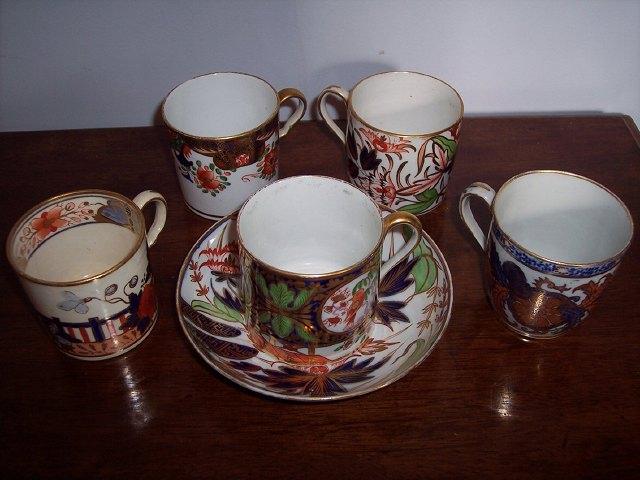 Appraisal: A Derby coffee can and saucer with four coffee cans