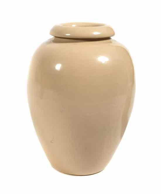 Appraisal: A Bauer Glazed Pottery Oil Jar having a beige glaze