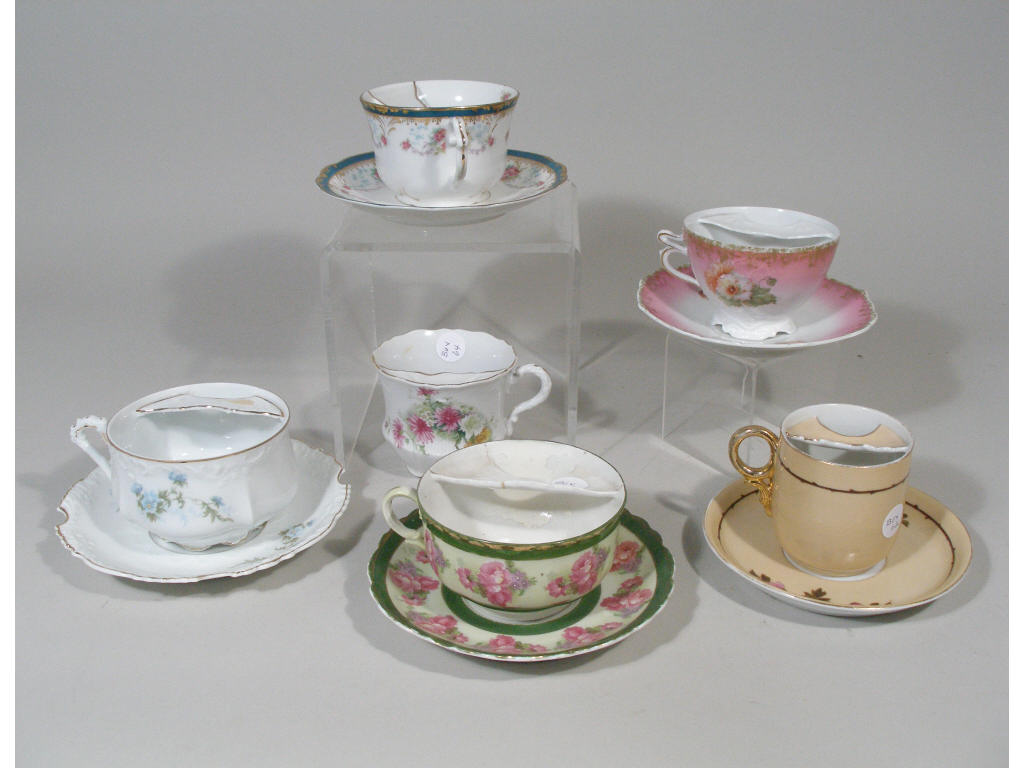 Appraisal: German Mustache Cups w saucers and w out saucers Victorian