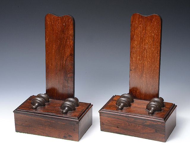 Appraisal: A PAIR OF ROSEWOOD PLATE STANDS with vertical splats and