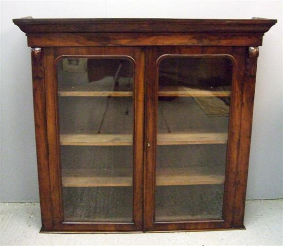 Appraisal: th century walnut bookcase cabinet the top with two glazed