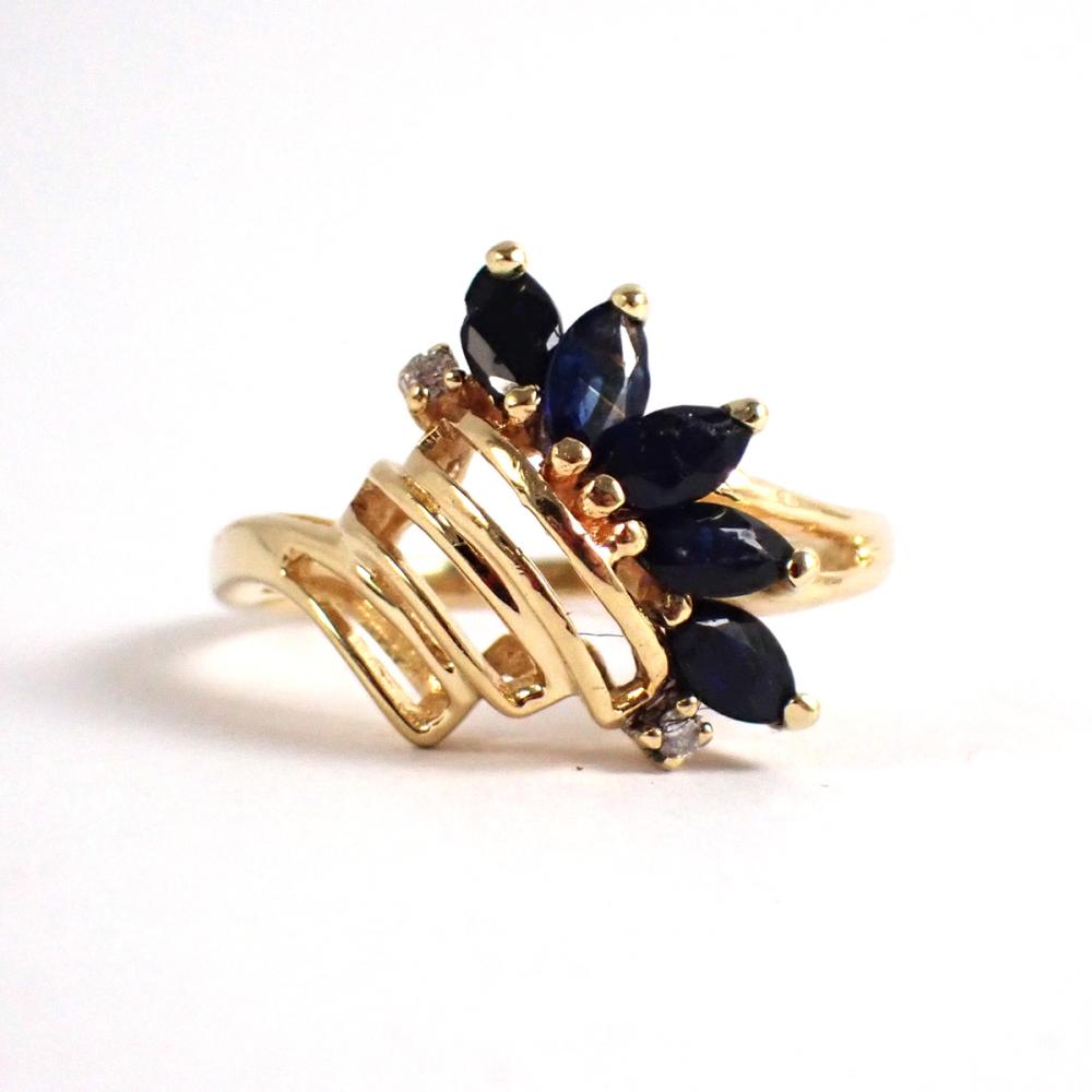 Appraisal: SAPPHIRE DIAMOND AND FOURTEEN KARAT GOLD RING set with five