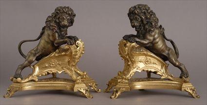 Appraisal: PAIR OF LOUIS XV-STYLE BRONZE AND GILT-METAL LION CHENETS Each