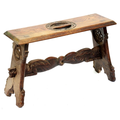 Appraisal: A Victorian medievalist trestle stool carved and pierced to the