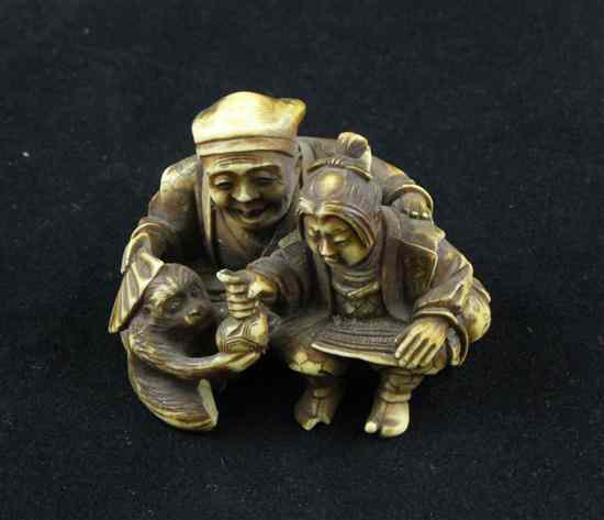 Appraisal: A Meiji period ivory netsuke carved as a Sarumawashi seated