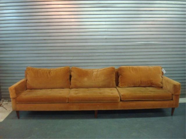 Appraisal: Mid Century sofa w rust-colored upholstery Dimensions x deep Estimate