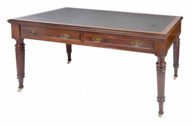 Appraisal: A VICTORIAN MAHOGANY WRITING TABLE with leatherette inset top two