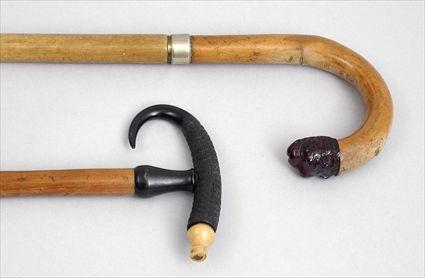 Appraisal: FRUITWOOD CANE AND A HORN-HANDLED SOUVENIR CANE The first with