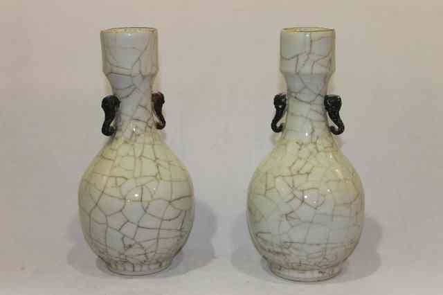 Appraisal: A PAIR OF CHINESE CRACKLEWARE VASES with elephant handles th