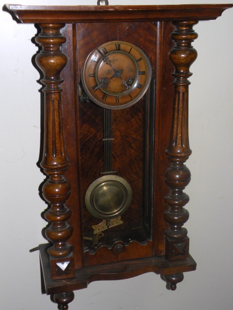 Appraisal: A late thC walnut cased Vienna wall clock the cm