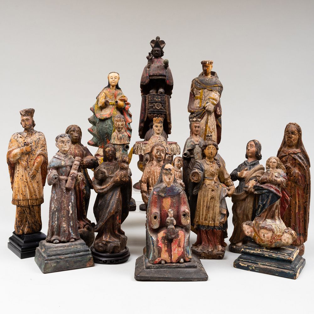 Appraisal: Group of Sixteen Polychromed Carved Wood Devotional Figures The largest