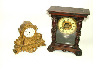 Appraisal: A French gilt metal cased mantel clock with eight day