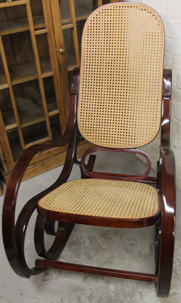 Appraisal: A thC American style steamer bentwood rocking chair in stained