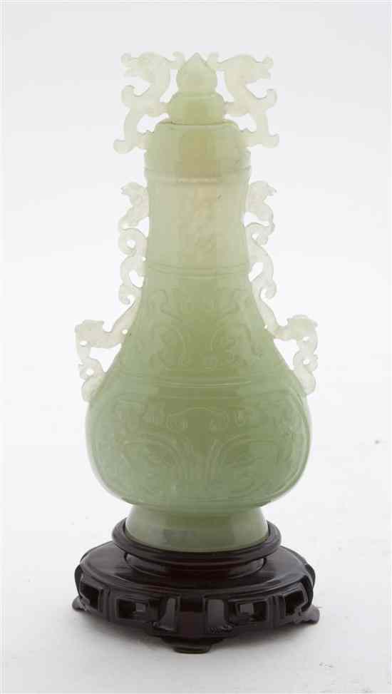 Appraisal: A Chinese Carved Hardstone Lidded Vase of semi-transparent green colored