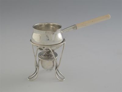 Appraisal: A small modern brandy saucepan with ivory handle and stand