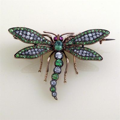 Appraisal: An Edwardian diamond and demantoid garnet set dragon fly brooch