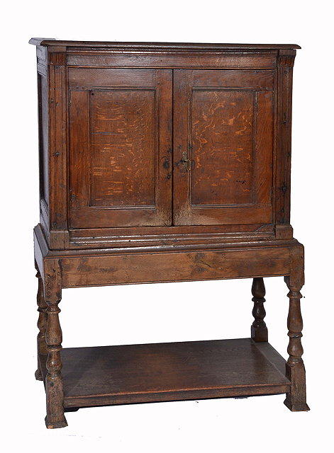 Appraisal: AN TH CENTURY OAK CUPBOARD ON STAND the interior fitted