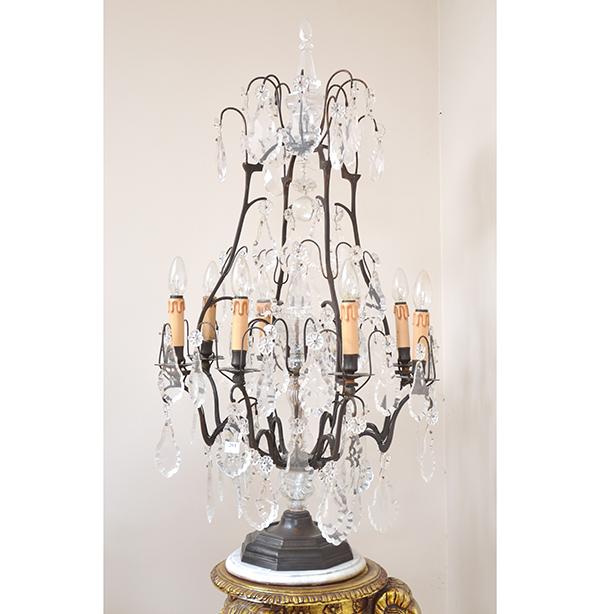 Appraisal: A PAIR OF WROUGHT IRON FRAMED CANDELABRA HUNG WITH CRYSTAL