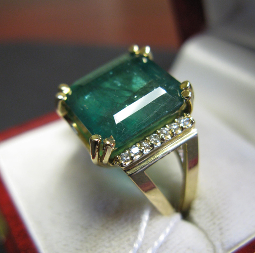 Appraisal: EMERALD DIAMOND AND FOURTEEN KARAT GOLD RING centered and prong