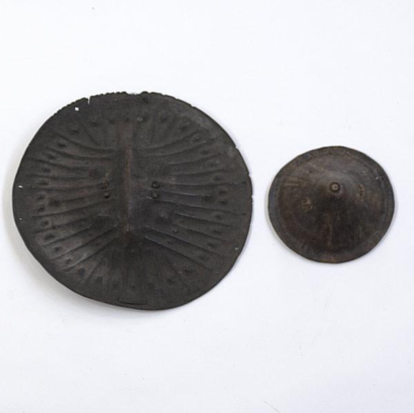 Appraisal: ETHIOPIAN RHINOCEROS HIDE SHIELDS Two item in circular form with