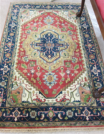 Appraisal: HAND KNOTTED ORIENTAL AREA RUG Persian Serapi design ' x