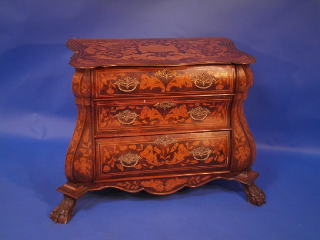 Appraisal: A Dutch style bombe three drawer commode inlaid overall with