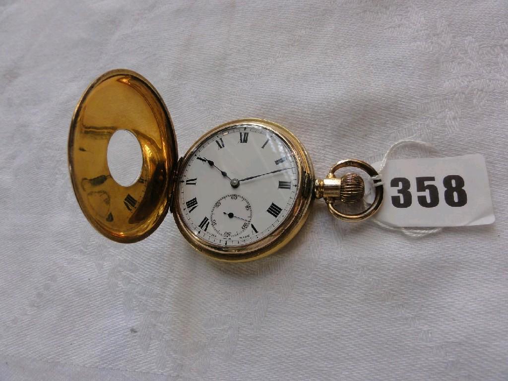 Appraisal: A gold plated half Hunter pocket watch with enamel dial