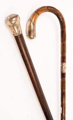 Appraisal: A silver mounted walking cane with hoop handle and an