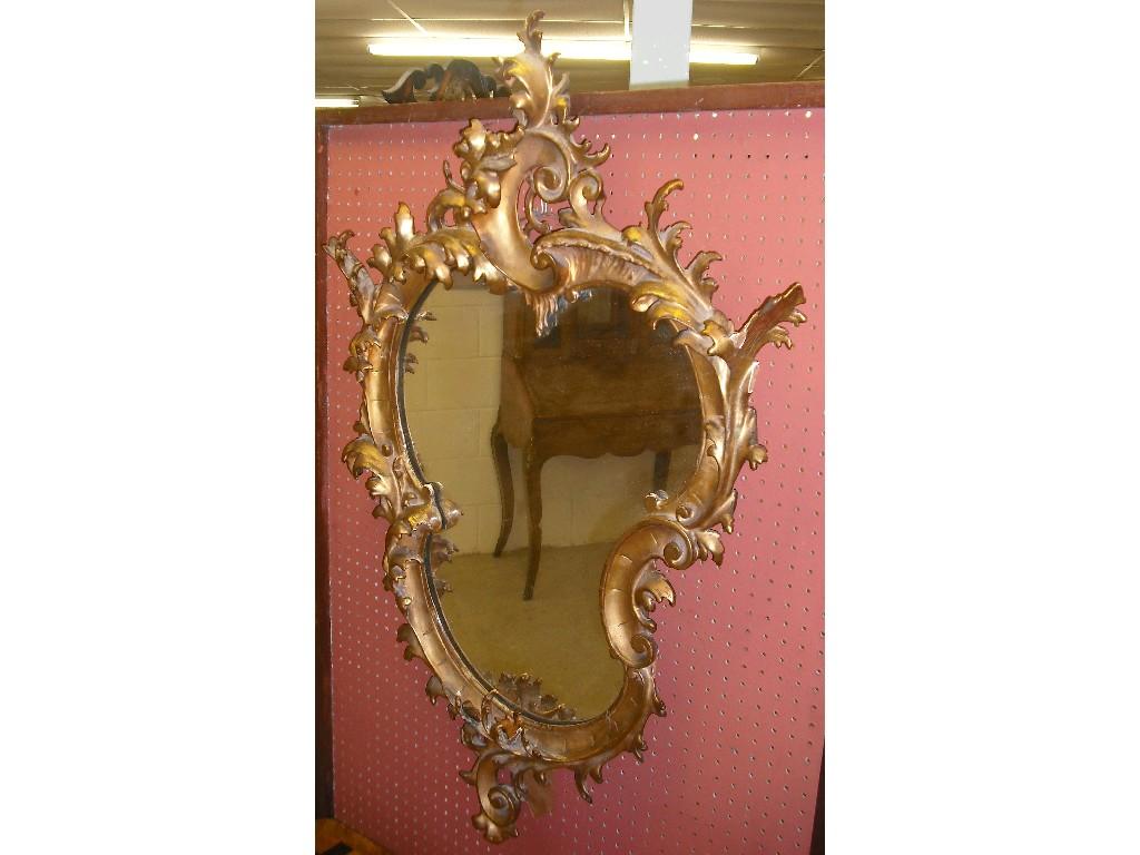 Appraisal: Ornate th century giltwood shaped wall mirror in the rococo