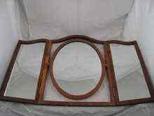 Appraisal: A three fold yew wood dressing table mirror the central