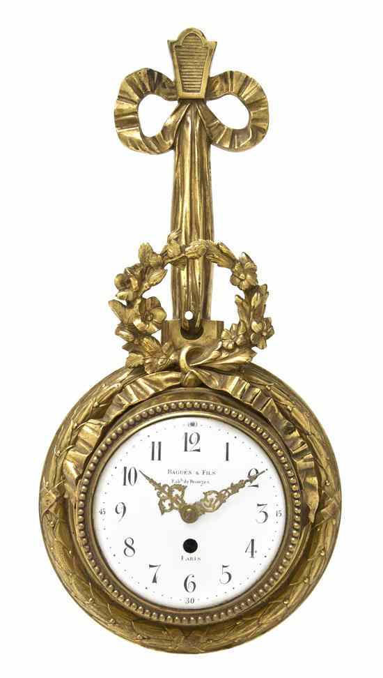 Appraisal: A Louis XVI Style Gilt Metal Cartel Clock Bagues Fils