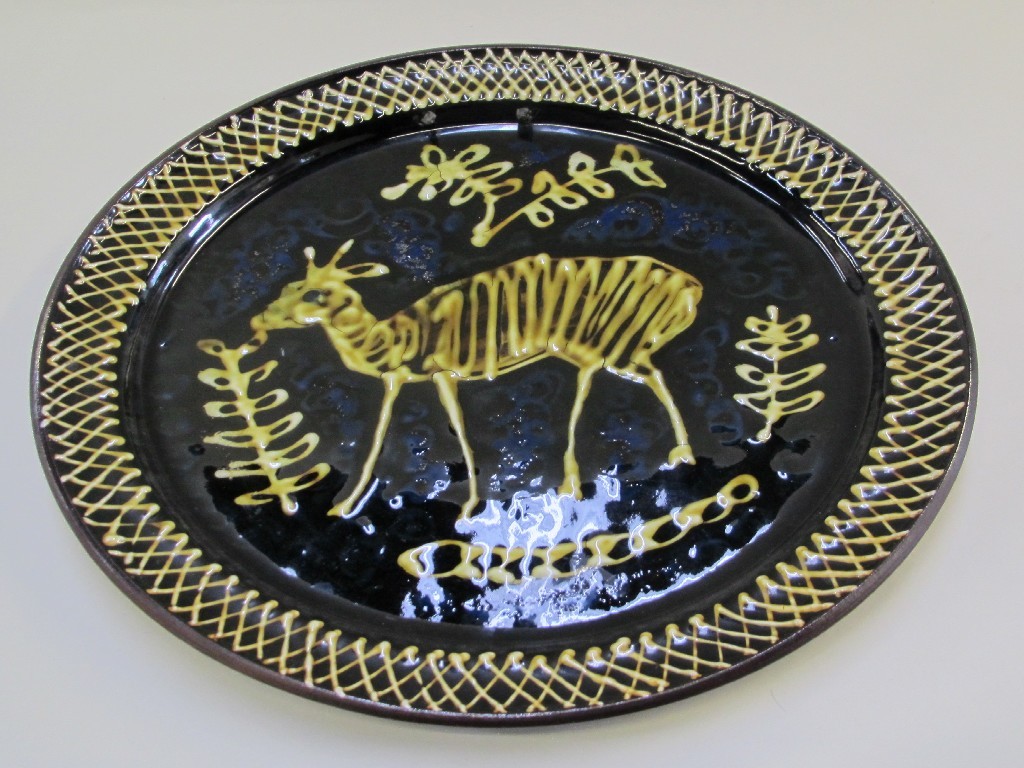 Appraisal: Studio pottery slipware charger decorated with a deer