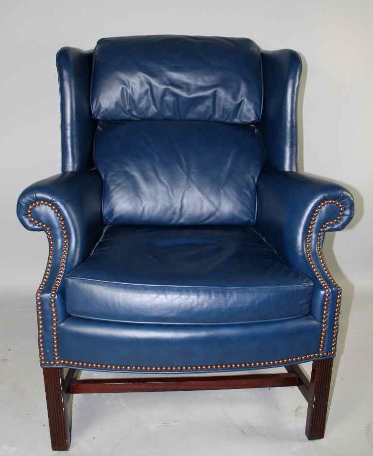 Appraisal: GEORGE III STYLE MAHOGANY BLUE LEATHER WINGBACK ARMCHAIR With straight