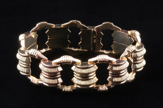 Appraisal: K YELLOW AND ROSE GOLD BRACELET Ribbed buckle style bracelet