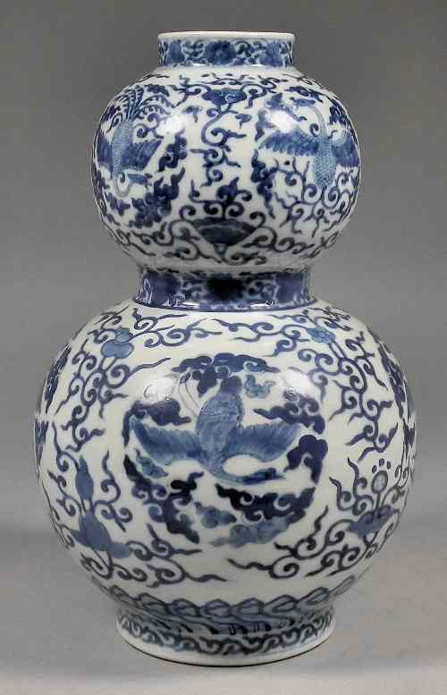 Appraisal: A Chinese porcelain gourd shaped vase painted in blue with