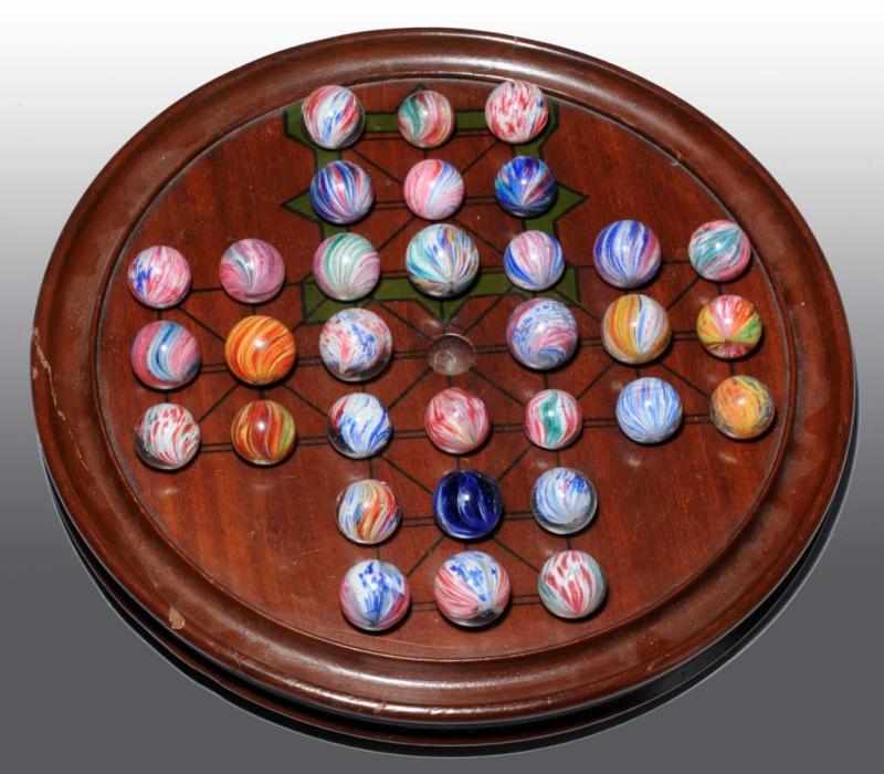 Appraisal: Solitaire Board Set Description Vintage board with onionskin marbles Several