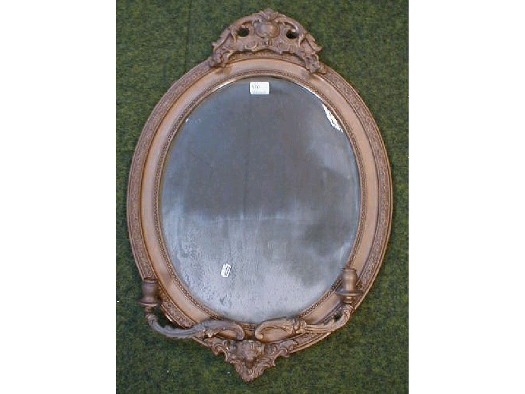 Appraisal: A pair of late thC oval gilt plaster wall mirrors