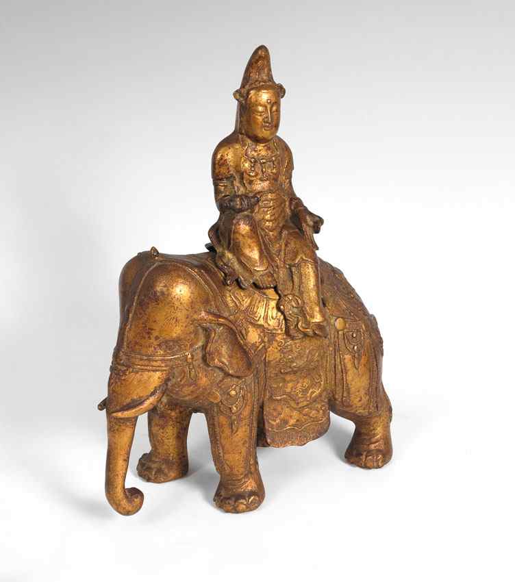 Appraisal: GILT BRASS DEITY RIDING AN ELEPHANT Figure of a seated