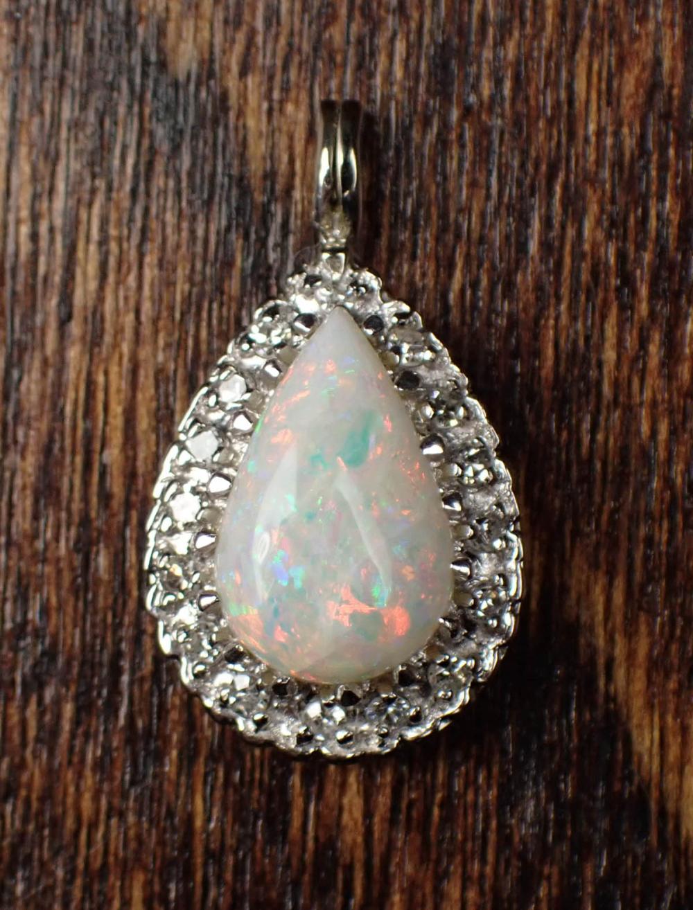 Appraisal: OPAL DIAMOND AND FOURTEEN KARAT GOLD PENDANT The white gold