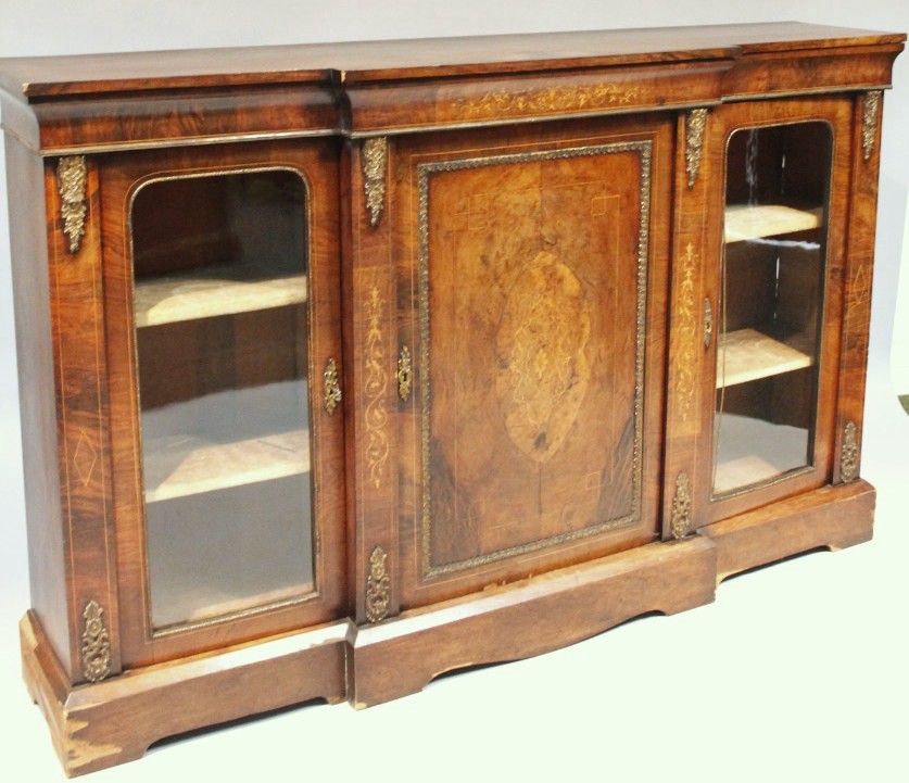 Appraisal: A thC walnut and inlaid breakfront credenza of rectangular outline