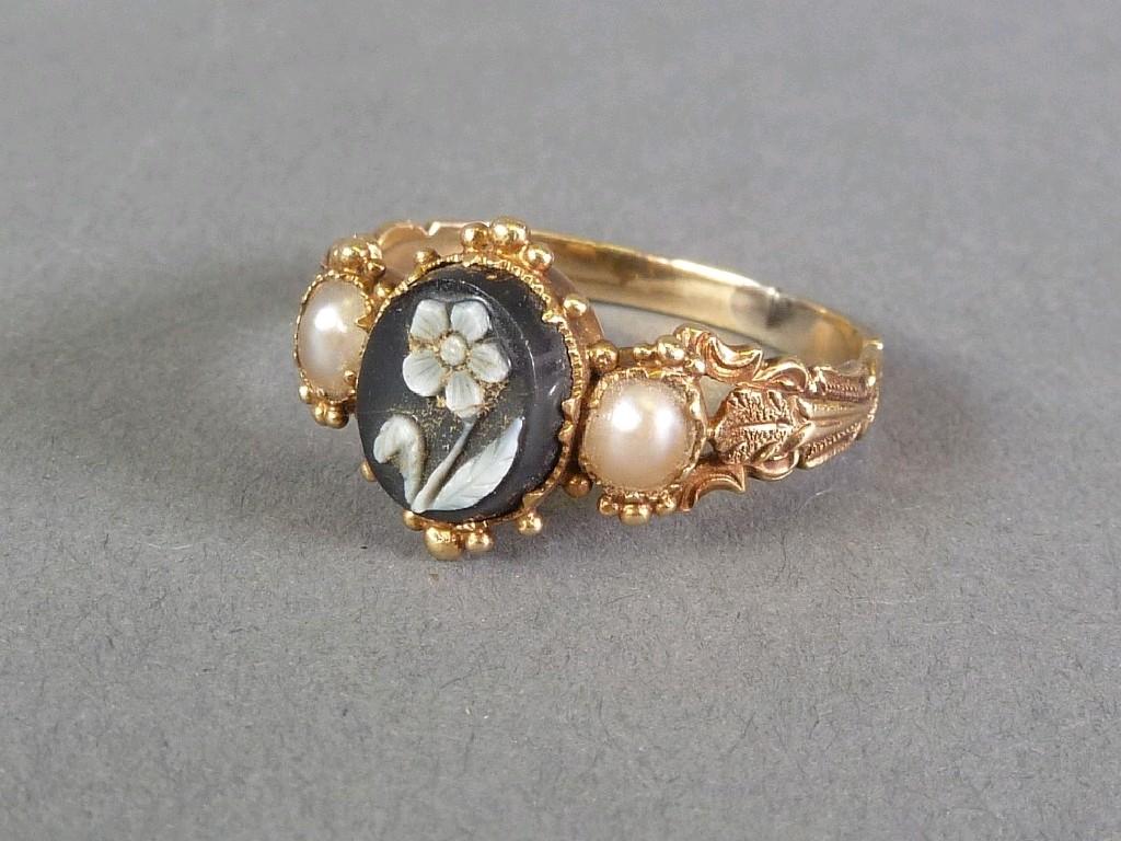 Appraisal: VICTORIAN GOLD RING SET WITH FLORAL CARVED OVAL BLACK AND