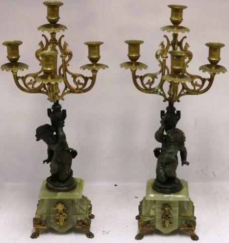 Appraisal: PAIR OF LATE TH C METAL AND ONYX CANDELABRAWITH PUTTI