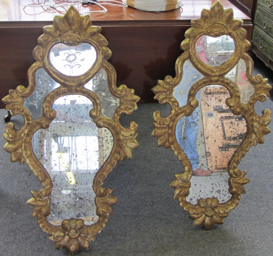 Appraisal: A pair of th century cartouche shaped gilt framed wall