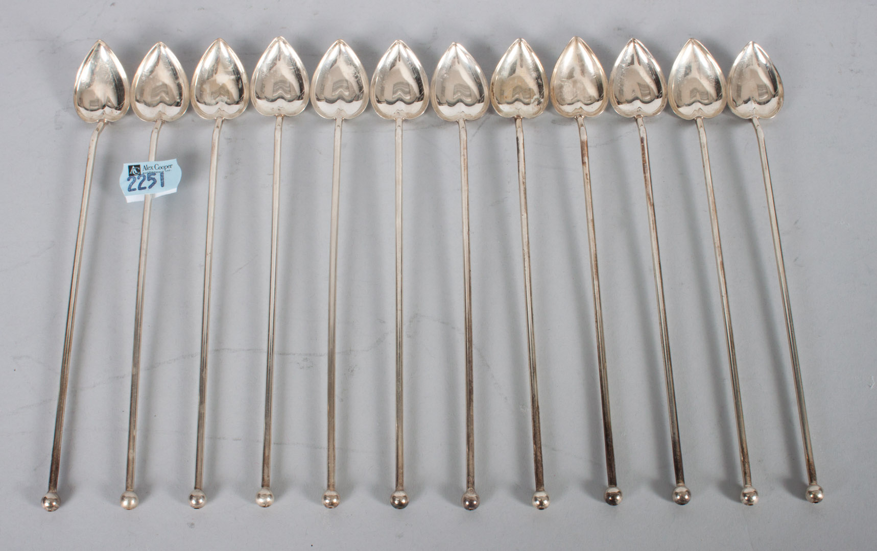 Appraisal: Twelve English sterling silver cocktail straws in L appears to